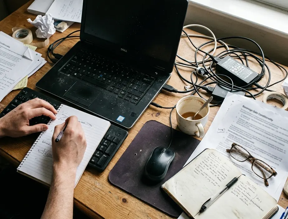Editorial desk with notes and drafts